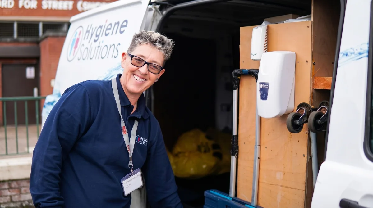 Hygiene Solutions engineer at a service van stocked with washroom supplies